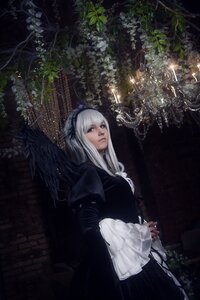 Rating: Safe Score: 0 Tags: 1girl black_dress dress flower frills gothic_lolita hairband lips long_hair long_sleeves looking_at_viewer plant solo standing suigintou wide_sleeves wings User: admin