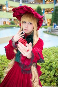 Rating: Safe Score: 0 Tags: 1girl blonde_hair blurry blurry_background blurry_foreground bonnet building depth_of_field dress flower hat long_hair looking_at_viewer outdoors photo red_dress rose shinku solo User: admin