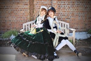 Rating: Safe Score: 0 Tags: 2girls apron brick_wall brown_hair closed_eyes dress fence hat head_scarf long_hair long_sleeves multiple_cosplay multiple_girls outdoors sitting smile tagme white_legwear User: admin