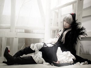 Rating: Safe Score: 0 Tags: 1girl black_dress dress frills gothic_lolita high_heel_boots high_heels indoors lolita_fashion long_hair long_sleeves looking_at_viewer sitting solo suigintou User: admin