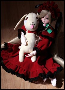 Rating: Safe Score: 0 Tags: 1girl blonde_hair bow doll dress flower long_hair red_dress rose shinku sitting solo stuffed_animal User: admin