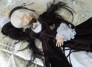 Rating: Safe Score: 0 Tags: 1girl arm_up black_dress closed_eyes doll dress frilled_sleeves frills hairband long_hair long_sleeves lying on_back solo suigintou User: admin