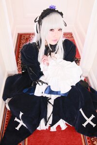 Rating: Safe Score: 0 Tags: 1girl bangs black_dress dress flower frills gothic_lolita hairband lips lolita_fashion long_hair long_sleeves looking_at_viewer red_eyes sitting solo suigintou white_hair User: admin