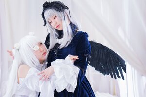 Rating: Safe Score: 0 Tags: 2girls angel_wings bangs black_dress black_wings closed_mouth dress feathered_wings feathers gothic_lolita lips lolita_fashion long_hair long_sleeves looking_at_viewer multiple_cosplay multiple_girls nail_polish tagme white_hair wings User: admin