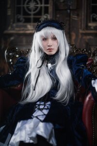 Rating: Safe Score: 0 Tags: 1girl bangs black_dress blurry blurry_background depth_of_field dress gothic_lolita hairband lips lolita_fashion long_hair long_sleeves looking_at_viewer sitting solo suigintou upper_body white_hair User: admin