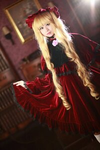 Rating: Safe Score: 0 Tags: 1girl blonde_hair blue_eyes blurry blurry_background depth_of_field dress flower long_hair long_sleeves looking_at_viewer red_dress rose shinku solo User: admin