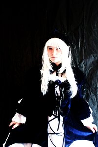Rating: Safe Score: 0 Tags: 1girl albino bangs black_background dress long_hair long_sleeves looking_at_viewer red_eyes solo standing suigintou white_hair User: admin