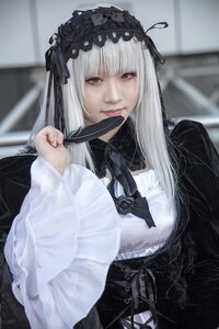 Rating: Safe Score: 0 Tags: 1girl bangs black_ribbon blurry blurry_background closed_mouth depth_of_field dress flower frills gothic_lolita hairband lolita_fashion long_hair long_sleeves looking_at_viewer red_eyes rose solo suigintou User: admin