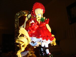 Rating: Safe Score: 0 Tags: 1girl blonde_hair blue_eyes bow doll dress flower full_body long_hair red_dress shinku solo standing white_legwear User: admin