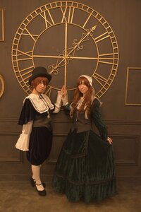 Rating: Safe Score: 0 Tags: 2girls 91076 brown_hair capelet dress hat indoors long_hair multiple_cosplay multiple_girls sitting standing tagme User: admin