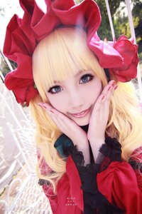 Rating: Safe Score: 0 Tags: 1girl bangs blonde_hair blue_eyes bow flower hands_on_own_face hat long_hair looking_at_viewer shinku smile solo User: admin