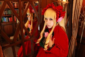 Rating: Safe Score: 0 Tags: 1girl blonde_hair blue_eyes bonnet bookshelf bow curtains dress flower indoors long_hair long_sleeves shinku solo table User: admin