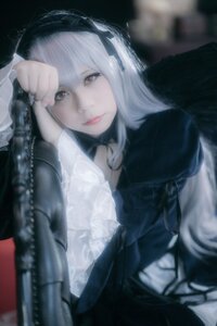 Rating: Safe Score: 0 Tags: 1girl blurry blurry_foreground choker closed_mouth depth_of_field doll_joints frills gothic_lolita hairband lips lolita_fashion long_hair long_sleeves looking_at_viewer lying red_eyes ribbon solo suigintou User: admin