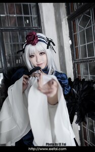 Rating: Safe Score: 0 Tags: 1girl blurry depth_of_field feathers flower hair_ornament hairband long_sleeves looking_at_viewer red_eyes solo suigintou white_hair User: admin