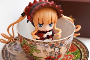 Rating: Safe Score: 0 Tags: 1girl blonde_hair blue_eyes blurry bonnet chibi cup depth_of_field doll dress figure food long_hair photo shinku solo teacup User: admin