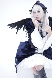 Rating: Safe Score: 0 Tags: 1girl black_wings boots dress feathered_wings feathers frills hairband long_hair long_sleeves looking_at_viewer ribbon silver_hair solo suigintou white_background wings User: admin