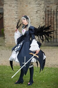 Rating: Safe Score: 0 Tags: 1girl blurry boots dress feathers flower frills hairband holding long_hair long_sleeves rose silver_hair solo standing suigintou sword weapon wings User: admin