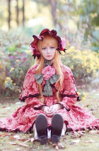 Rating: Safe Score: 0 Tags: 1girl bangs blonde_hair blue_eyes blurry blurry_background bonnet depth_of_field dress flower long_hair looking_at_viewer outdoors shinku sitting solo User: admin