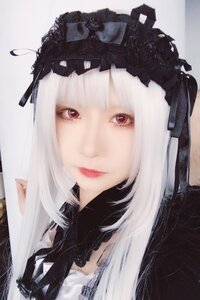 Rating: Safe Score: 0 Tags: 1girl bangs closed_mouth lips long_hair looking_at_viewer portrait red_eyes ribbon smile solo suigintou User: admin