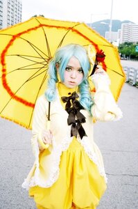 Rating: Safe Score: 0 Tags: 1girl blue_hair blurry bow depth_of_field dress drill_hair frills kanaria parasol solo umbrella yellow_dress User: admin