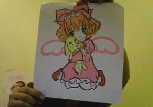 Rating: Safe Score: 0 Tags: 1girl blonde_hair bow dress frills green_eyes hina_ichigo hinaichigo image looking_at_viewer photo pink_bow red_dress short_hair sitting smile solo stuffed_animal traditional_media User: admin