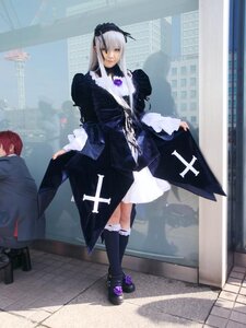 Rating: Safe Score: 0 Tags: 1girl black_dress city cross dress frills long_hair long_sleeves silver_hair solo standing suigintou User: admin