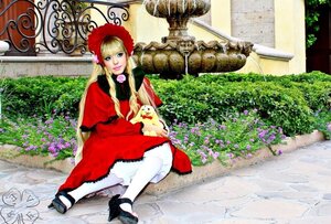 Rating: Safe Score: 0 Tags: 1girl blonde_hair blue_eyes bonnet capelet dress flower long_hair long_sleeves looking_at_viewer red_capelet red_dress shinku shoes sitting solo white_legwear User: admin