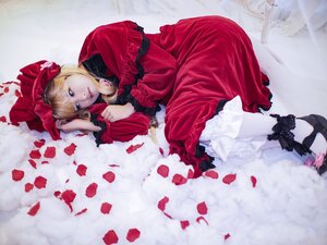 Rating: Safe Score: 0 Tags: 1girl bangs blonde_hair blue_eyes bonnet bow dress flower frills lips long_sleeves looking_at_viewer lying on_side petals red_dress rose_petals shinku solo User: admin