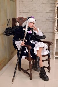 Rating: Safe Score: 0 Tags: 1girl blue_eyes boots chair cross-laced_footwear gun instrument long_hair rifle sitting solo suigintou weapon white_hair wings User: admin