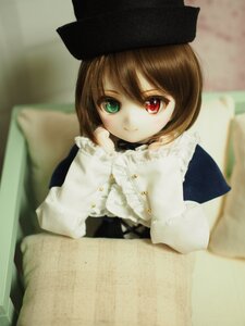 Rating: Safe Score: 0 Tags: 1girl black_headwear blurry blurry_background brown_hair buttons closed_mouth depth_of_field doll hat heterochromia long_sleeves looking_at_viewer pantyhose photo red_eyes short_hair sitting smile solo souseiseki User: admin