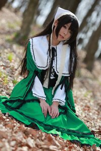 Rating: Safe Score: 0 Tags: 1girl black_hair blurry blurry_background blurry_foreground depth_of_field dress frills green_dress long_hair long_sleeves looking_at_viewer sitting solo suiseiseki v_arms User: admin