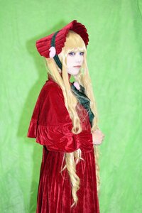Rating: Safe Score: 0 Tags: 1girl bangs blonde_hair blue_eyes bonnet capelet dress flower green_background lips long_hair looking_at_viewer red_capelet red_dress shinku solo standing User: admin