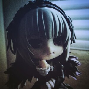 Rating: Safe Score: 0 Tags: 1girl bandages black_dress blurry blurry_background depth_of_field doll dress hairband lolita_hairband monochrome photo smile solo suigintou User: admin