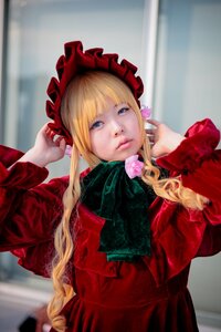 Rating: Safe Score: 0 Tags: 1girl bangs blonde_hair blue_eyes blurry blurry_background bonnet bow dress flower lips long_hair long_sleeves looking_at_viewer photo red_dress rose shinku solo User: admin