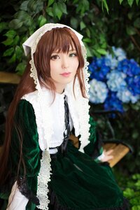 Rating: Safe Score: 0 Tags: 1girl bangs blurry blurry_background blurry_foreground brown_hair closed_mouth depth_of_field dress flower frills green_dress green_eyes heterochromia lips long_hair looking_at_viewer plant red_eyes sitting solo suiseiseki User: admin