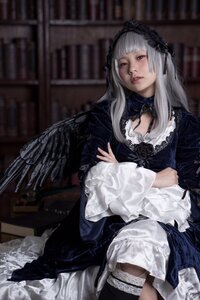 Rating: Safe Score: 0 Tags: 1girl bangs black_legwear blurry blurry_background bookshelf depth_of_field dress frills gothic_lolita indoors lace lips lolita_fashion long_hair long_sleeves looking_at_viewer red_eyes sitting solo suigintou User: admin