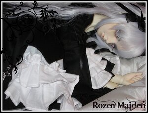 Rating: Safe Score: 0 Tags: 1girl black_border border doll flower letterboxed long_hair long_sleeves lying pillarboxed ribbon solo suigintou white_hair User: admin