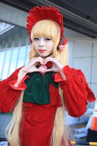 Rating: Safe Score: 0 Tags: 1girl blonde_hair blue_eyes blurry blurry_background bonnet bow depth_of_field dress heart heart_hands long_hair long_sleeves looking_at_viewer photo red_dress shinku solo User: admin