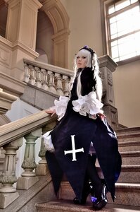 Rating: Safe Score: 0 Tags: 1girl dress frills gothic_lolita indoors long_sleeves solo stairs standing suigintou User: admin