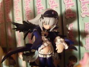 Rating: Safe Score: 0 Tags: 1girl black_dress black_wings blurry blurry_background blurry_foreground depth_of_field doll dress frills hairband long_hair long_sleeves motion_blur photo ribbon silver_hair solo suigintou very_long_hair wings User: admin