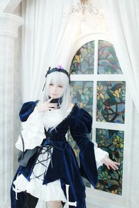 Rating: Safe Score: 0 Tags: 1girl bangs closed_mouth curtains dress flower frills hairband long_hair long_sleeves looking_at_viewer solo standing suigintou white_hair User: admin