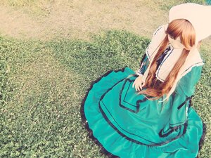 Rating: Safe Score: 0 Tags: 1girl brown_hair dress frills green_dress long_hair long_sleeves sitting solo suiseiseki very_long_hair User: admin