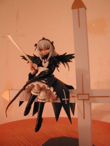 Rating: Safe Score: 0 Tags: 1girl boots closed_mouth doll dress frills full_body hairband long_sleeves solo standing suigintou sword weapon wings User: admin