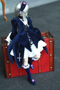 Rating: Safe Score: 0 Tags: 1girl black_dress blonde_hair blurry boots depth_of_field doll dress frills full_body hair_ornament long_hair long_sleeves photo solo standing suigintou User: admin