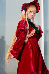 Rating: Safe Score: 0 Tags: 1girl bangs blonde_hair blue_eyes blurry bonnet dress flower lips long_hair long_sleeves looking_at_viewer realistic red_dress shinku solo standing User: admin