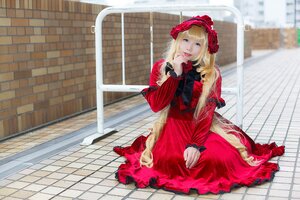 Rating: Safe Score: 0 Tags: 1girl blonde_hair blue_eyes blurry bonnet brick_wall building depth_of_field dress fence flower long_hair long_sleeves looking_at_viewer pavement red_dress shinku sitting solo tile_floor tiles User: admin