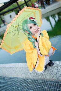 Rating: Safe Score: 0 Tags: 1girl black_footwear blurry blurry_background blurry_foreground depth_of_field dress flower frills green_hair hair_flower holding_umbrella kanaria looking_at_viewer outdoors parasol photo red_umbrella smile solo transparent_umbrella umbrella User: admin