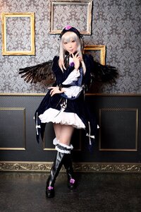 Rating: Safe Score: 0 Tags: 1girl black_wings boots dress frills full_body hairband long_hair long_sleeves silver_hair solo standing suigintou wings User: admin