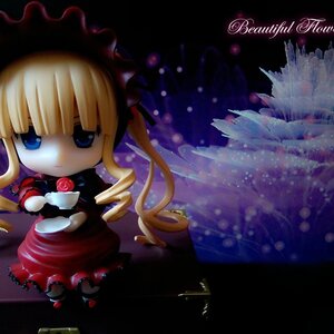 Rating: Safe Score: 0 Tags: 1girl blonde_hair blue_eyes bonnet bow chibi cup doll dress drill_hair flower long_hair long_sleeves looking_at_viewer pink_rose red_dress rose shinku sitting solo teacup twintails User: admin