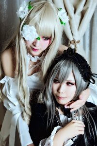 Rating: Safe Score: 0 Tags: 2girls flower green_eyes hair_flower hair_ornament lips lolita_fashion long_hair looking_at_viewer multiple_cosplay multiple_girls realistic suigintou tagme white_flower User: admin